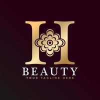 elegant h luxe logo. gouden bloemen alfabet logo met bloemen bladeren. perfect voor mode, sieraden, schoonheidssalon, cosmetica, spa, boetiek, bruiloft, postzegel, hotel- en restaurantlogo. vector