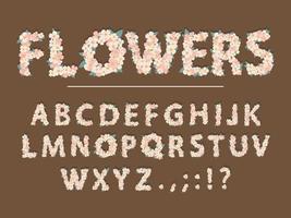 lente bloemen cartoon lettertype. schattige bloembrieven voor wenskaart, babydouche, valentijnsdag, bloemenwinkel, meisjesmagazine, collages. het papier is uitgesneden. vector illustratie