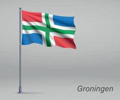 wapperende vlag van groningen - provincie nederland op vlaggenmast.