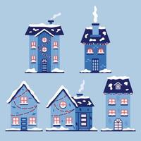 set van kerst besneeuwde huizen vector