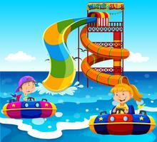 Jongen en meisje rijden op water glijbaan in de oceaan vector
