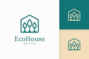 natuur groen huis logo met boom en bladvorm vector