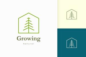 natuur groen huis logo met boom en bladvorm vector