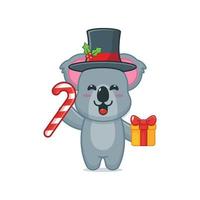 schattig koala stripfiguur met kerstsnoep en cadeau vector