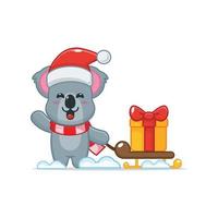 schattig koala stripfiguur met kerstcadeaudoos vector