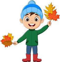 cartoon kleine jongen met herfstbladeren vector