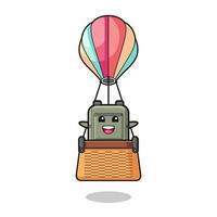 schooltas mascotte rijden in een heteluchtballon vector