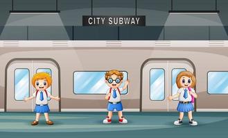 cartoon van schoolkinderen in een treinstation vector