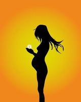 silhouet van de zwangere vrouw met een bloem in handen vector