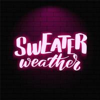 truienweer. neon gloeiende letters op een bakstenen muur achtergrond. vector kalligrafie illustratie. typografie voor banners, badges, ansichtkaarten, tshirts, prenten, posters.