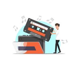 een man stopt een cassette in de muziekspeler vector