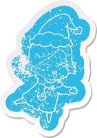 happy cartoon noodlijdende sticker van een meisje met een kerstmuts vector
