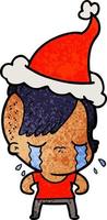 getextureerde cartoon van een huilend meisje met een kerstmuts vector