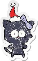 verontruste sticker cartoon van een kat met een kerstmuts vector