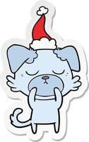 leuke stickercartoon van een hond met een kerstmuts vector