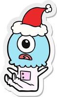 sticker cartoon van een cyclops buitenaardse ruimtevaarder met een kerstmuts vector