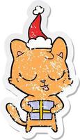 schattige, verontruste stickercartoon van een kat met een kerstmuts vector