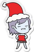 stickercartoon van een ondode vampiermeisje met een kerstmuts vector