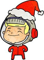 vrolijke getextureerde cartoon van een astronaut die een kerstmuts draagt vector