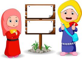 moslim kids cartoon met houten bord vector