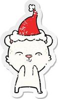 vrolijke, verontruste stickercartoon van een ijsbeer met een kerstmuts vector