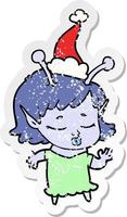 schattig buitenaards meisje verontruste sticker cartoon van een dragende kerstmuts vector