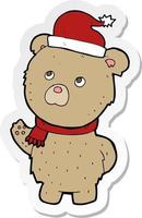 sticker van een cartoon kerstteddybeer vector