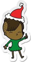 sticker cartoon van een loensend meisje met een kerstmuts vector