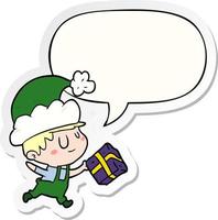 cartoon happy christmas elf en cadeau en tekstballon sticker vector