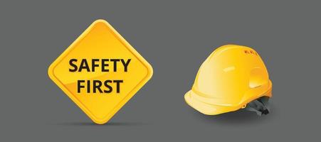 veiligheid eerste teken op achtergrond, bouwconcept, gele veiligheidshelm