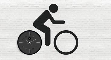 een fietser op een fiets en zwart geverfd, met een klok met een wijzerplaat en pijlen in de vorm van fietswielen tegen een grijze bakstenen muur. ruimte kopiëren. vector illustratie