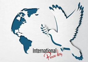 close-up een duif vrede met wereldkaart in papier gesneden stijl en internationale vredesdag belettering op wit papieren patroon en donkerblauwe achtergrond. vector