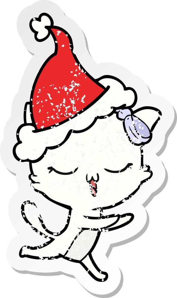 Distressed Sticker Cartoon einer Katze mit Schleife auf dem Kopf mit Weihnachtsmütze vektor