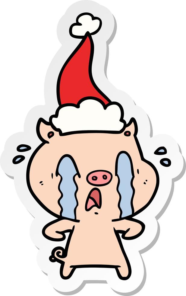 Aufkleberkarikatur des weinenden Schweins einer tragenden Weihnachtsmannmütze vektor