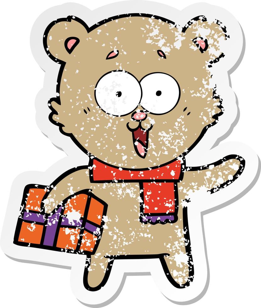 bedrövad klistermärke av en skrattande nallebjörn med julklapp vektor