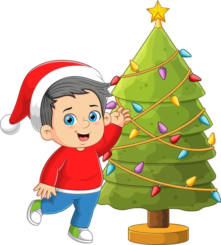 de Lycklig pojke är dekorera och löpning runt om de jul träd vektor
