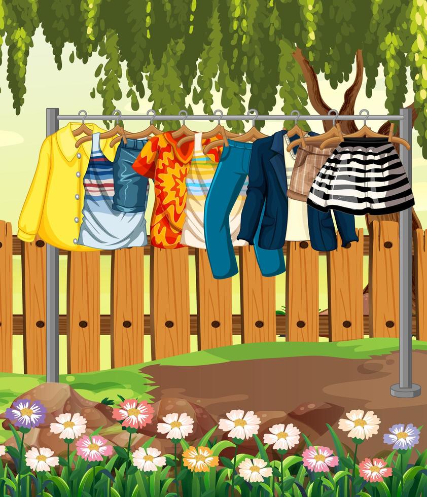 kläder som hänger på en klädstreck med staket och blomma i trädgårdsplatsen vektor