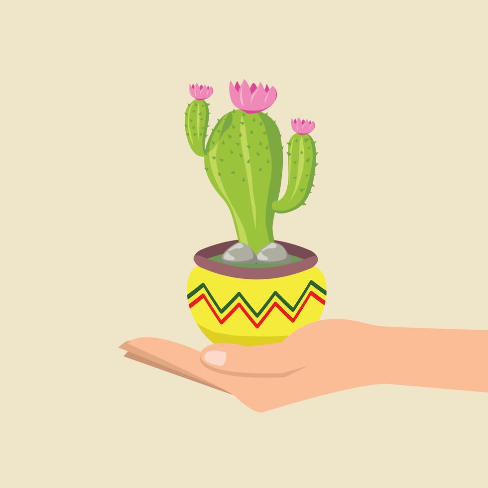 Hand hält einen niedlichen Kaktus in einem bunten Topf vektor