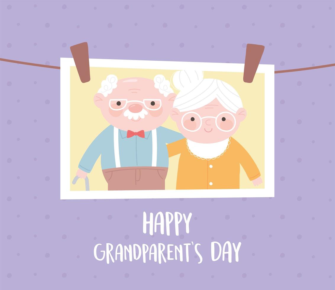 glücklicher Tag der Großeltern, hängendes Foto mit alter Paarkarikaturkarte vektor