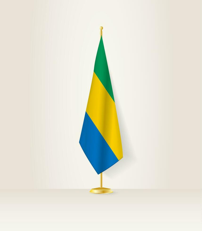 gabon Flagge auf ein Flagge Stand. vektor