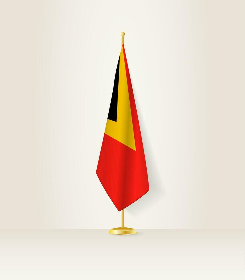 Osten Timor Flagge auf ein Flagge Stand. vektor