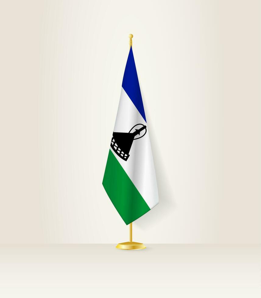 Lesotho Flagge auf ein Flagge Stand. vektor