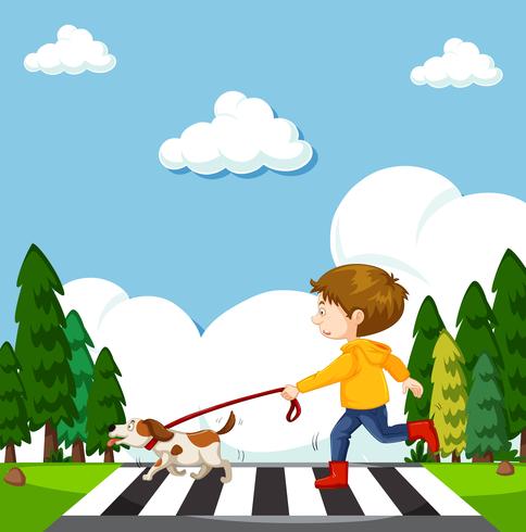 En Boy Crossing Street med hund vektor