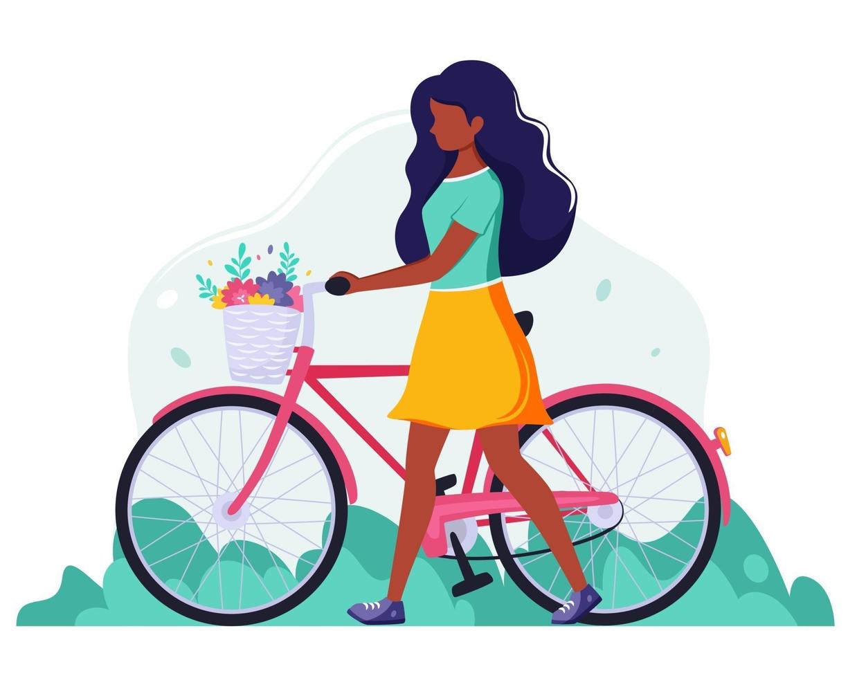 svart kvinna med en cykel med blommor i korgen. utomhusaktivitet. vektor