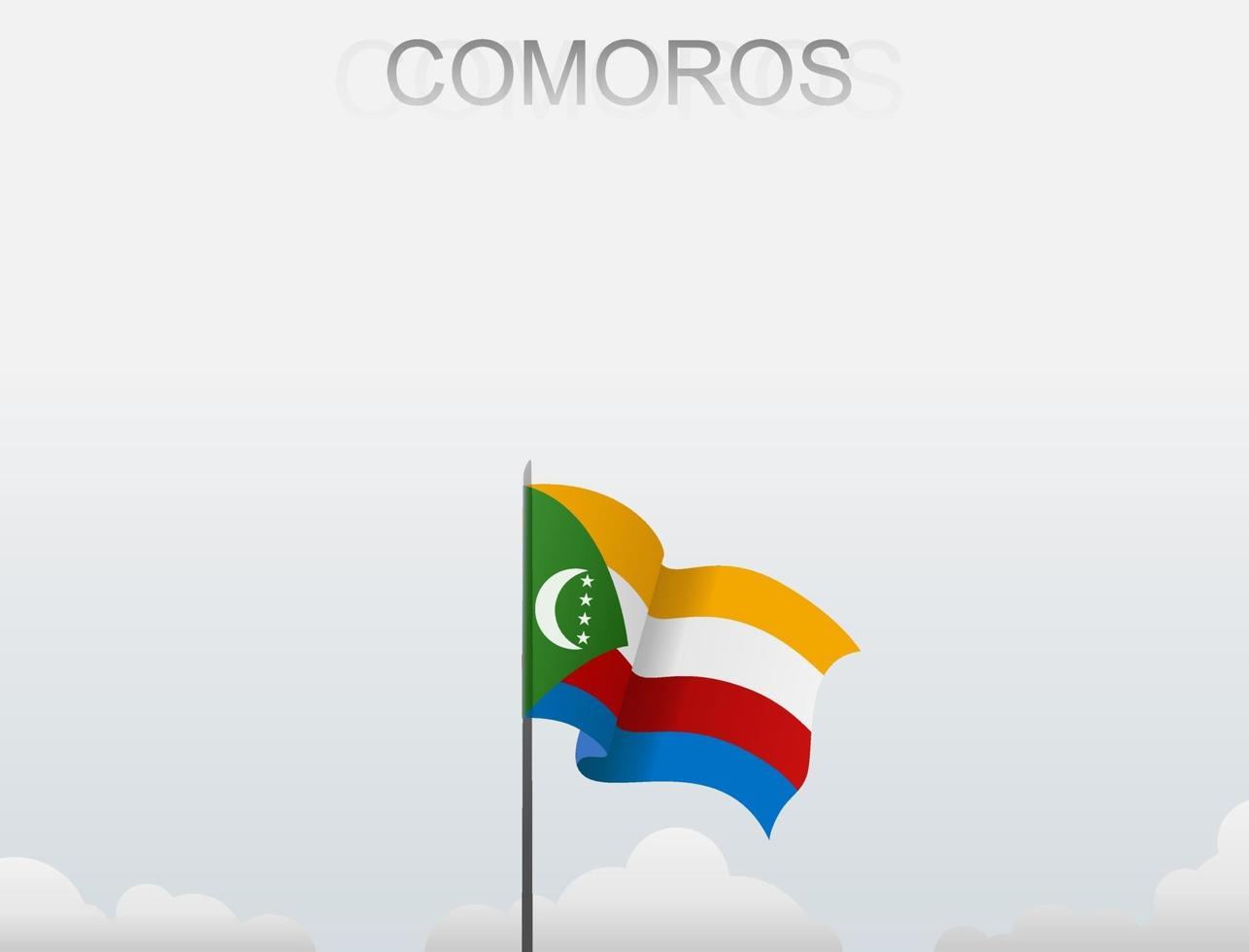 Die Flagge der Komoren weht an einem Mast, der hoch unter dem weißen Himmel steht vektor
