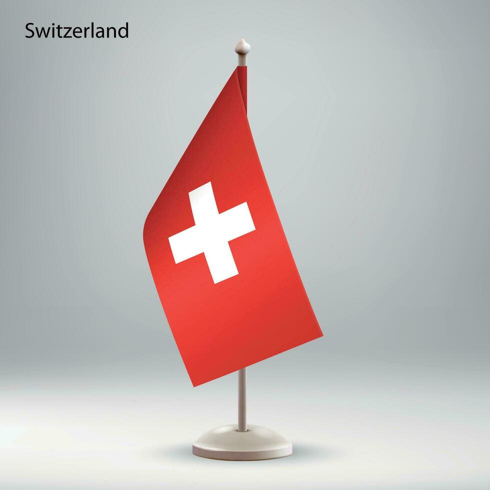 flagga av schweiz hängande på en flagga stå. vektor