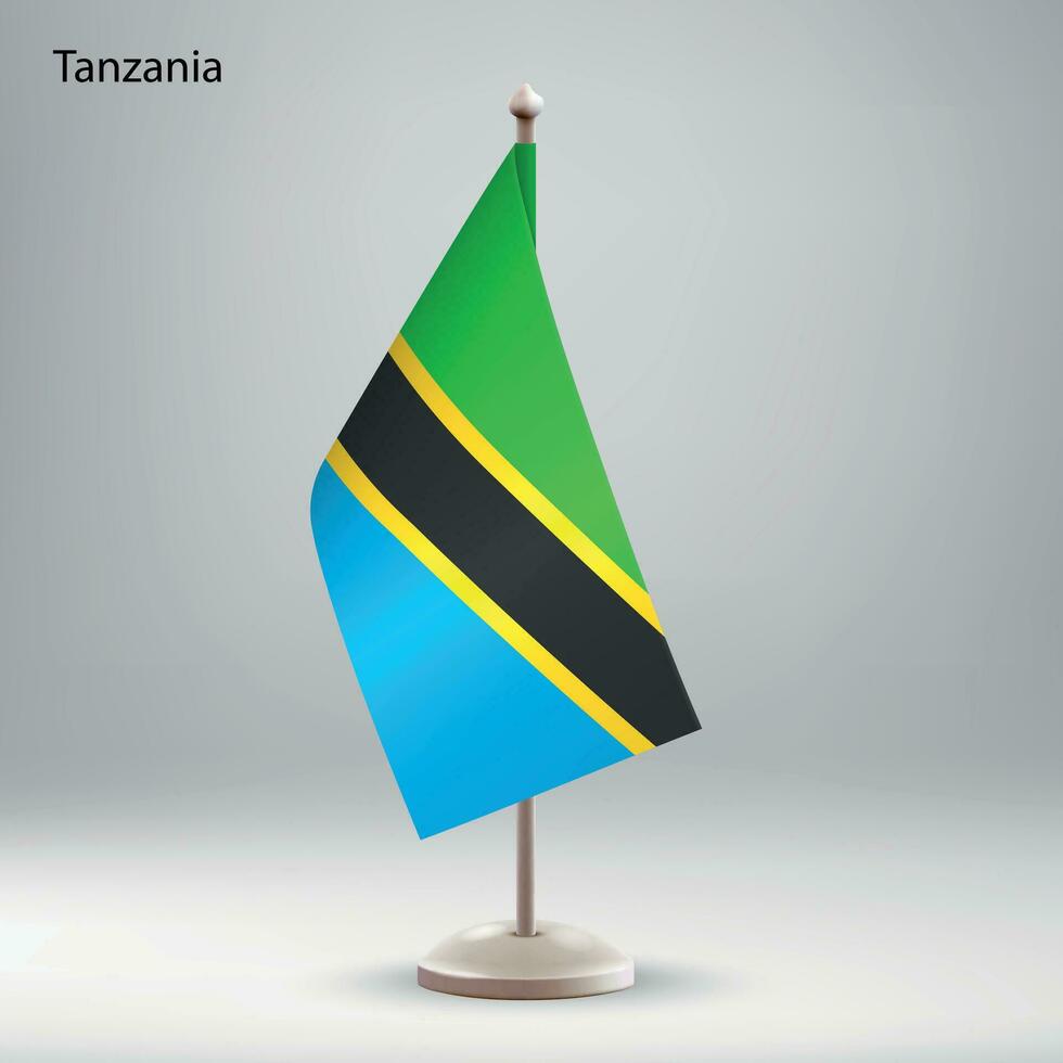 flagga av tanzania hängande på en flagga stå. vektor