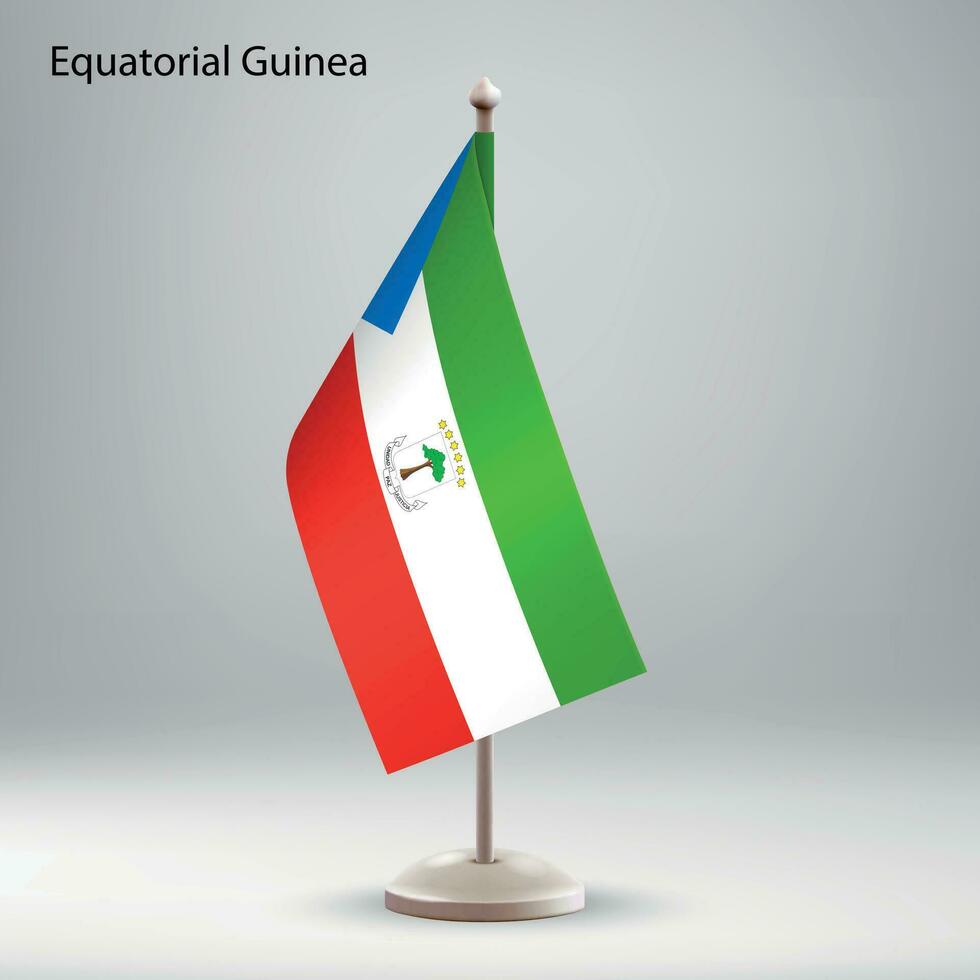 Flagge von äquatorial Guinea hängend auf ein Flagge Stand. vektor
