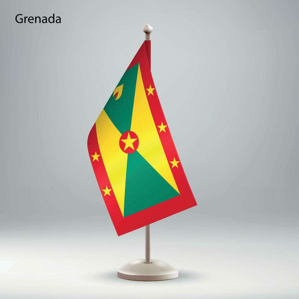 Flagge von Grenada hängend auf ein Flagge Stand. vektor