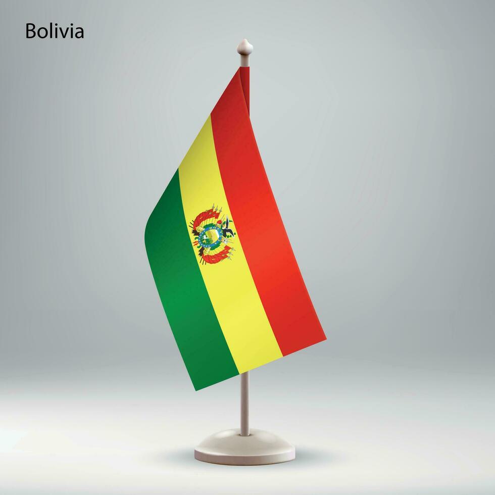 Flagge von Bolivien hängend auf ein Flagge Stand. vektor